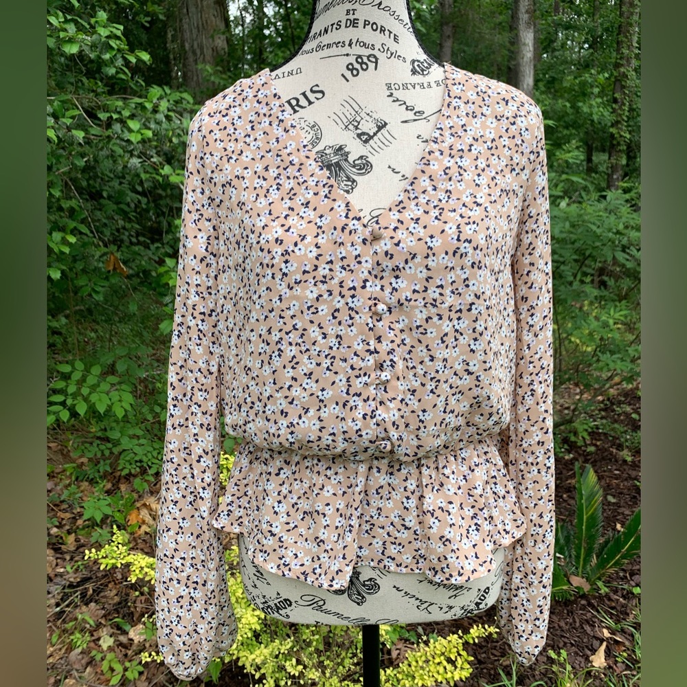 Floral blouse with navy, white and tan fabric.